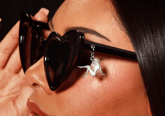 Black Beyoncé merch Beymine heart sunglasses lifestyle view with silver silhouette charm detail