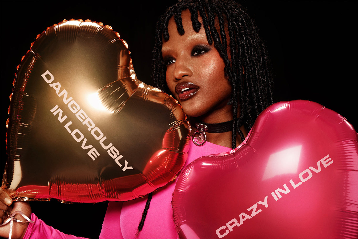 Heart balloons featuring Dangerously in Love and Crazy in Love text in gold and pink