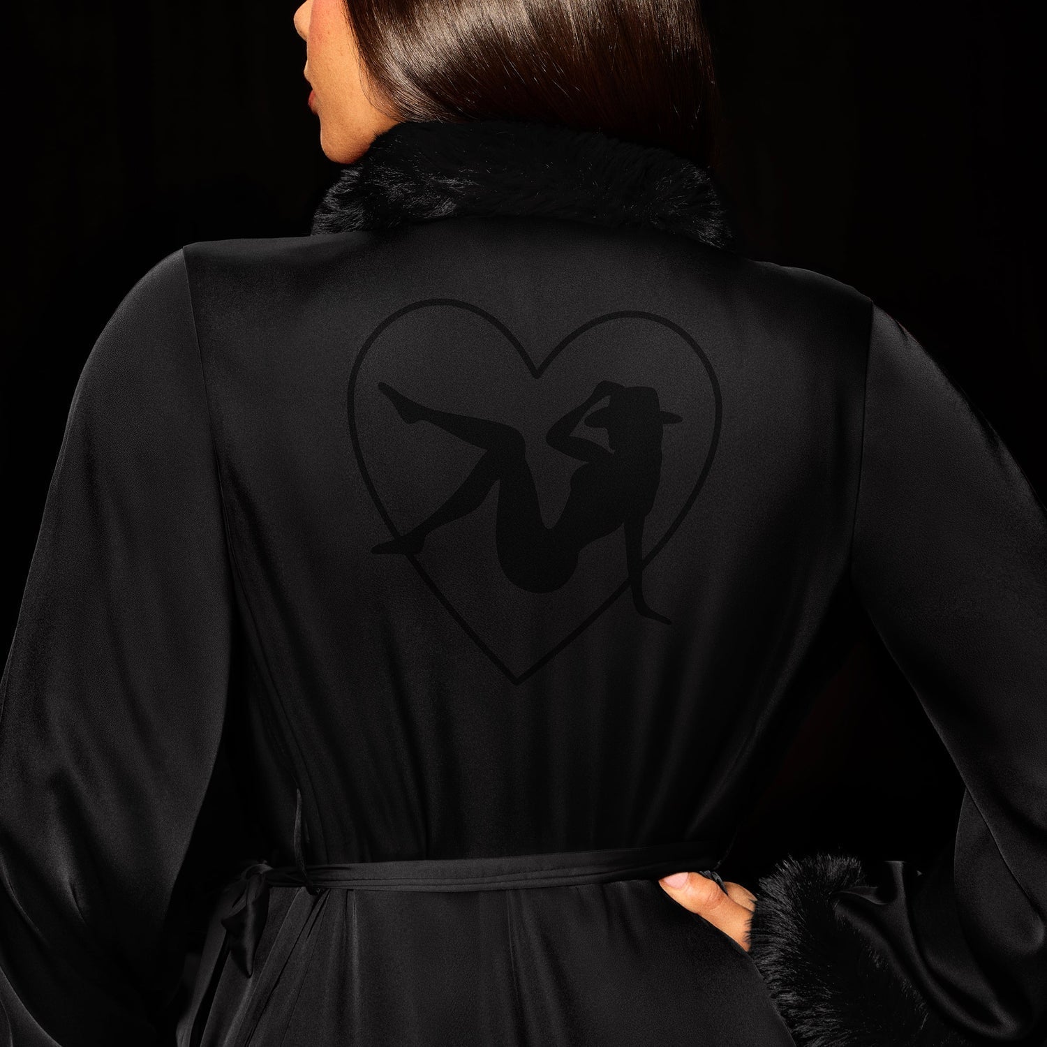 Black Beyoncé merch Renaissance satin robe back view with heart silhouette graphic and plush trim
