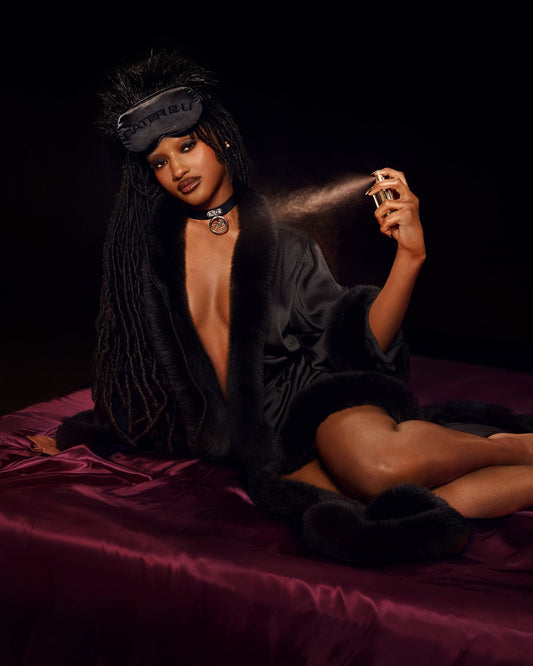 Black Beyoncé merch Renaissance satin robe lifestyle view with plush trim and luxe satin styling
