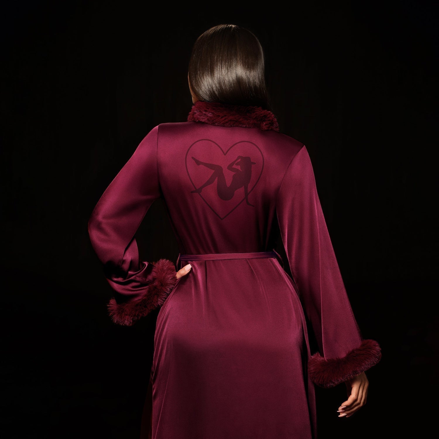 Cherry wine Beyoncé merch Renaissance satin robe back view with heart silhouette graphic and plush trim
